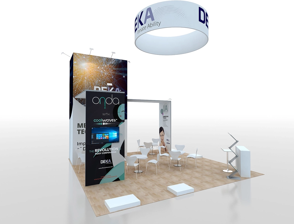 Spacious trade show booth with seating and signage