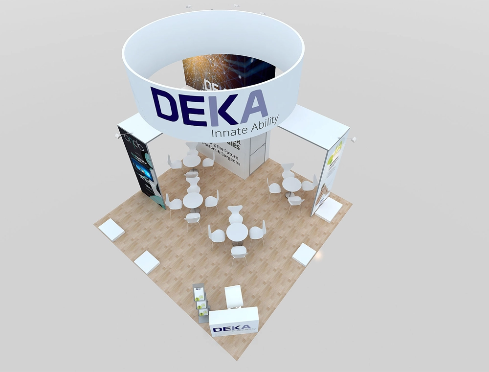 Spacious trade show booth with seating and signage